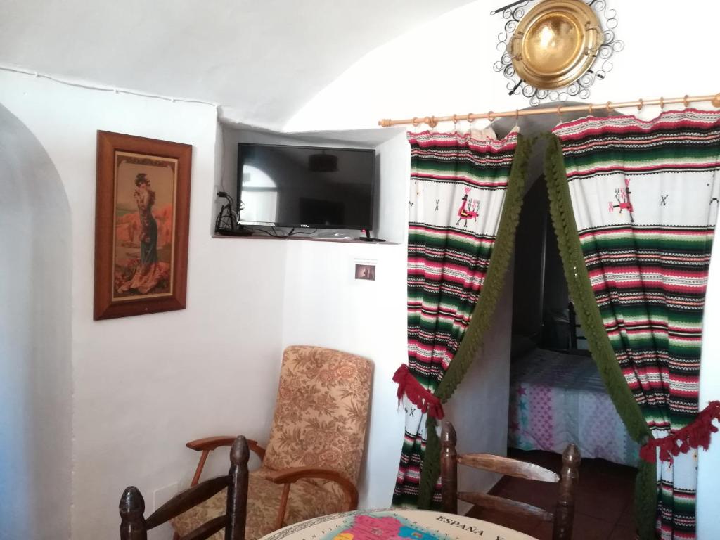 Posezení v ubytování Cuevas de María