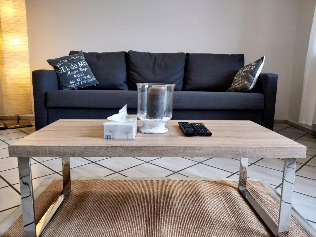 a coffee table in a living room with a couch at AVI Deluxe Altstadt Apart in Düsseldorf