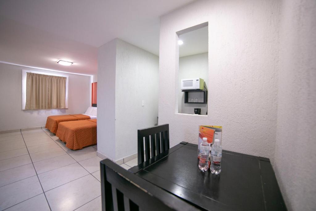 Postel nebo postele na pokoji v ubytování Hotel RS Suites