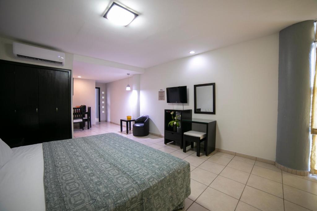 Postel nebo postele na pokoji v ubytování Hotel RS Suites