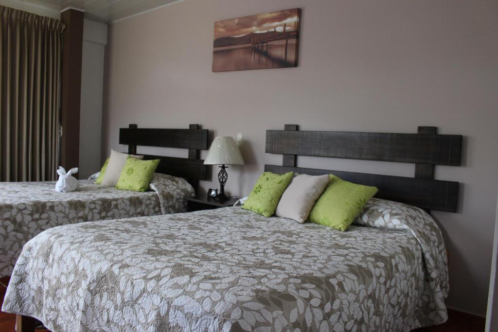 Postel nebo postele na pokoji v ubytování Hotel Arenal by Regina