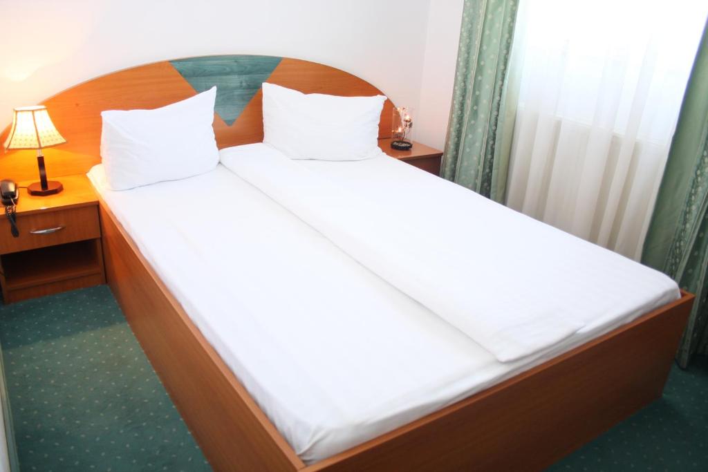 Postel nebo postele na pokoji v ubytování Hotel Sir Orhideea