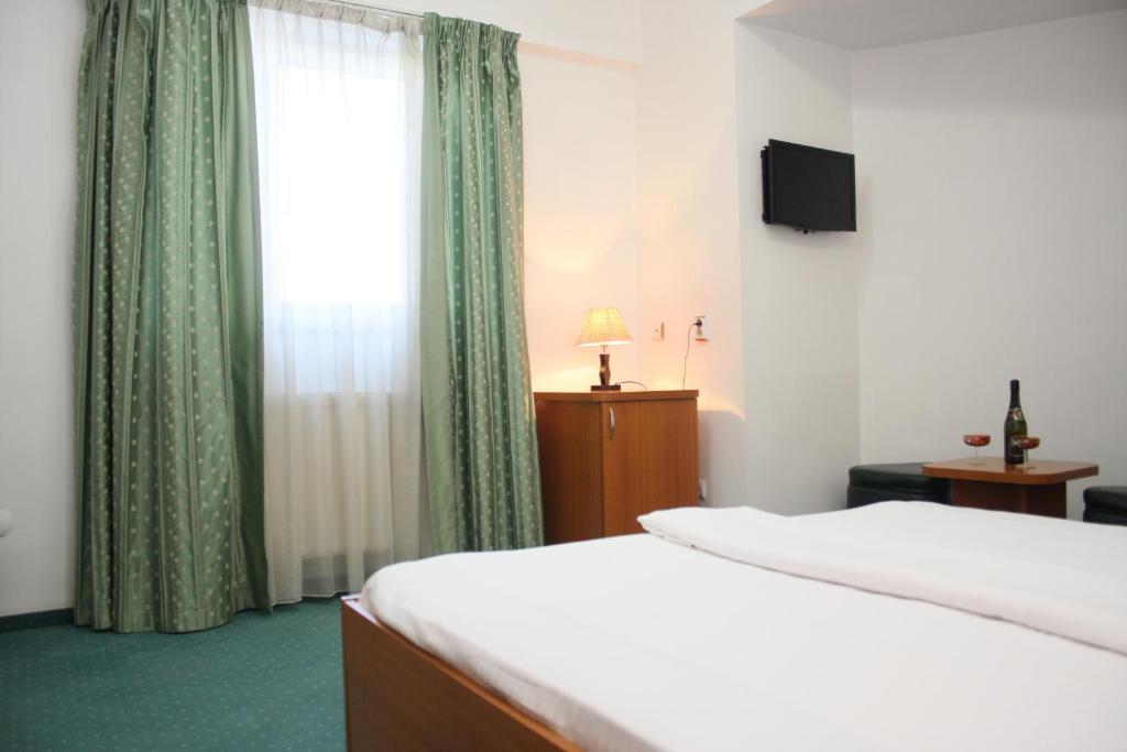Postel nebo postele na pokoji v ubytování Hotel Sir Orhideea
