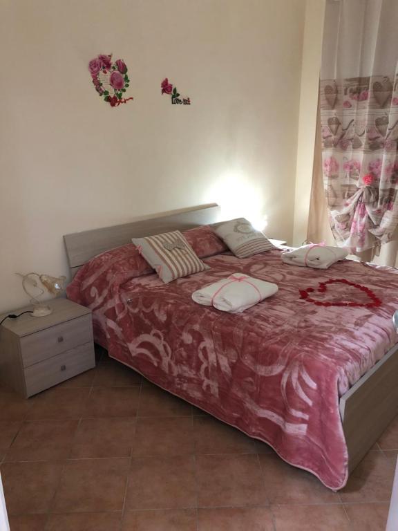 Łóżko lub łóżka w pokoju w obiekcie B&B la reggia