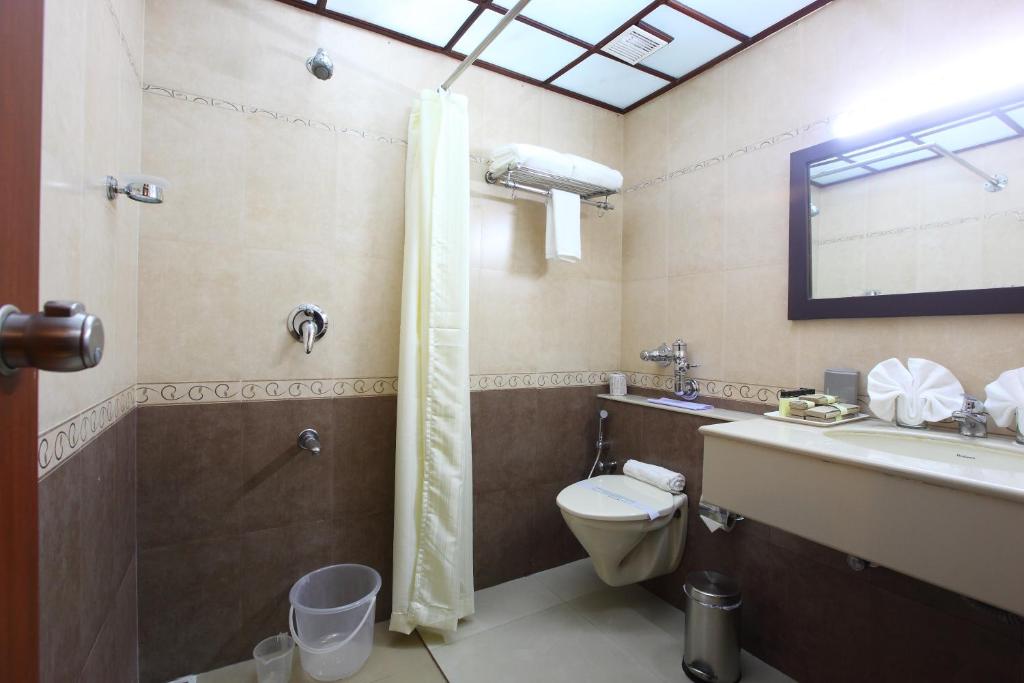 Koupelna v ubytování Park Residency Luxury Business Hotel