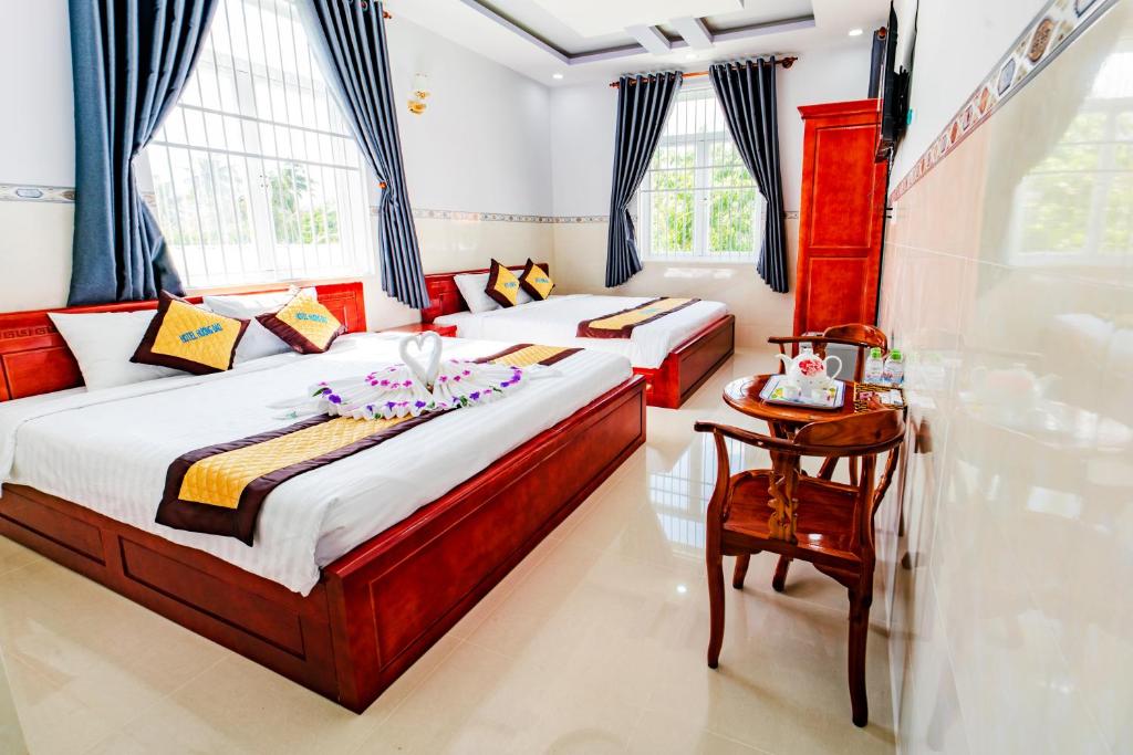 Postel nebo postele na pokoji v ubytování Hotel Hương Đào