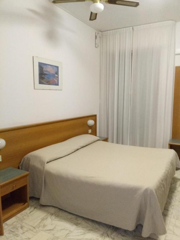 Postel nebo postele na pokoji v ubytování Hotel Valentino