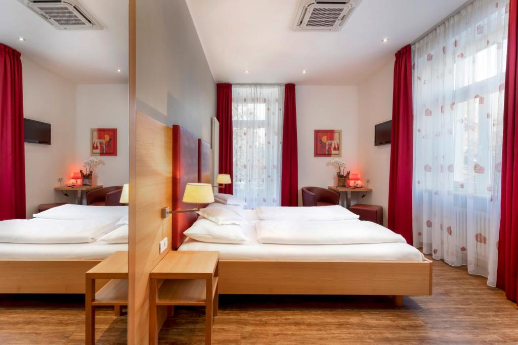 Postel nebo postele na pokoji v ubytování Hotel Kolping