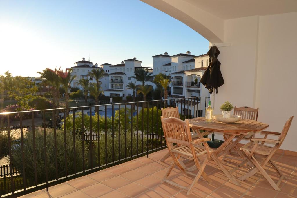 a patio with a table and chairs on a balcony at Casa Emperador - A Murcia Holiday Rentals Property in Roldán