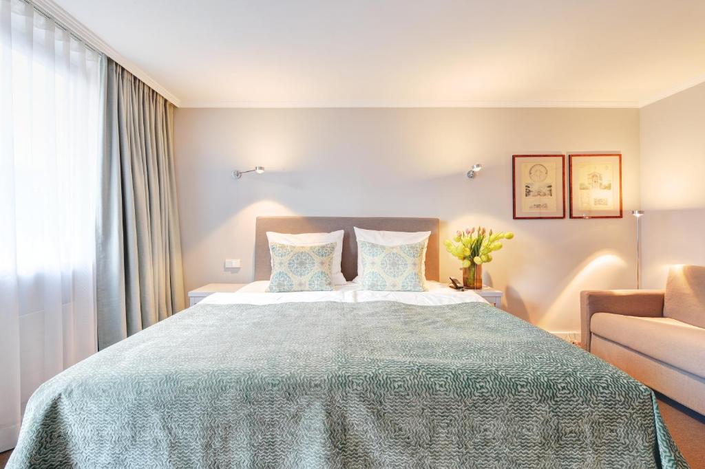 Postel nebo postele na pokoji v ubytování Hotel Admiral