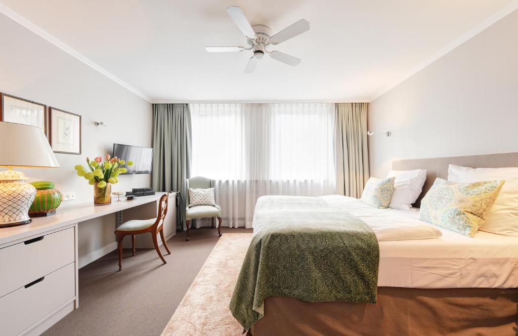 Postel nebo postele na pokoji v ubytování Hotel Admiral