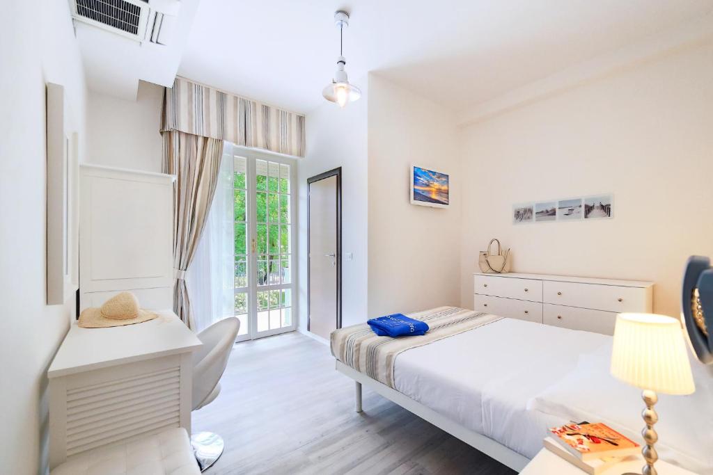 Postel nebo postele na pokoji v ubytování Hotel Fabrizio