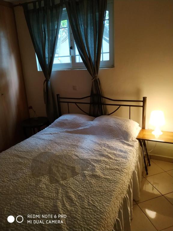 Posteľ alebo postele v izbe v ubytovaní Stavros Apartments