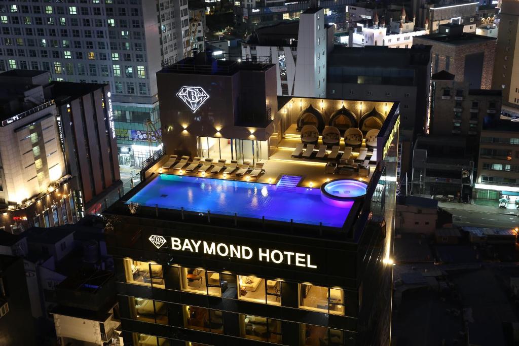 a view of the bay mind hotel at night at Baymond Hotel in Busan