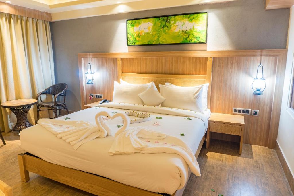 Postel nebo postele na pokoji v ubytování Kushal Palli Resorts- A unit of PearlTree Hotels & Resorts