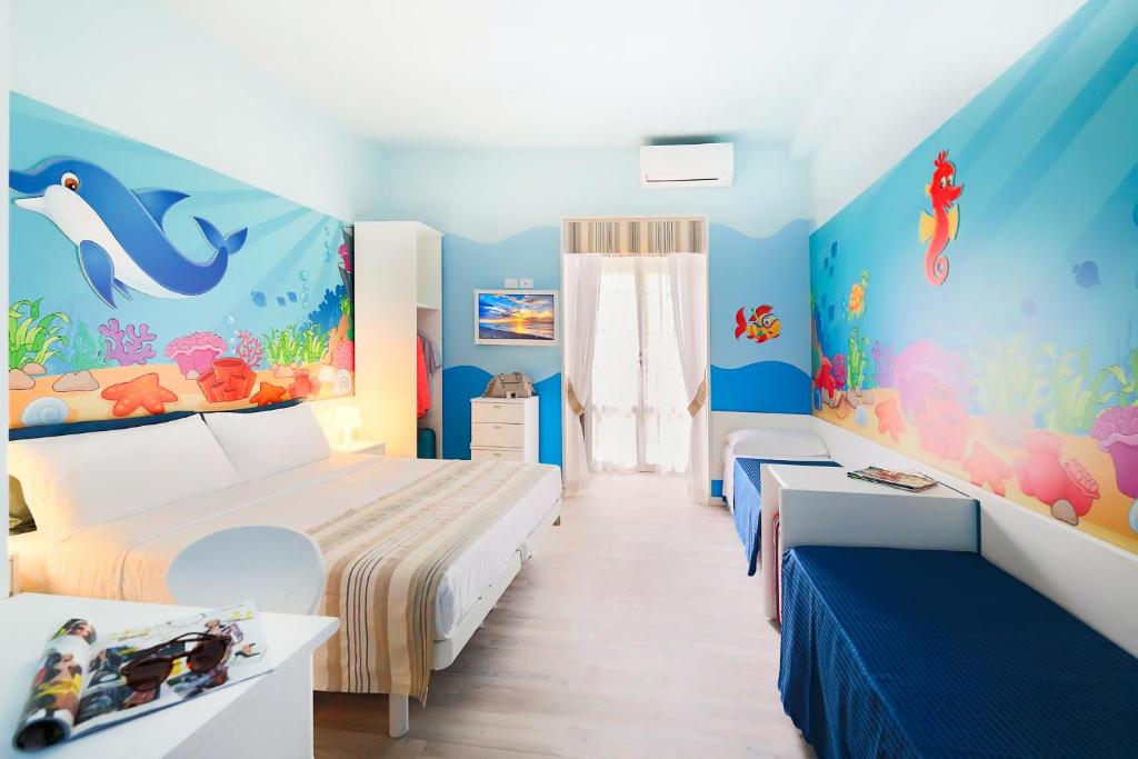 Postel nebo postele na pokoji v ubytování Hotel Fabrizio