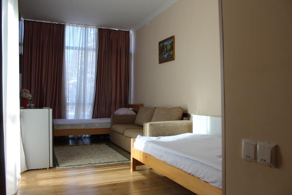 Postel nebo postele na pokoji v ubytování Hotel Borjomi Aisi