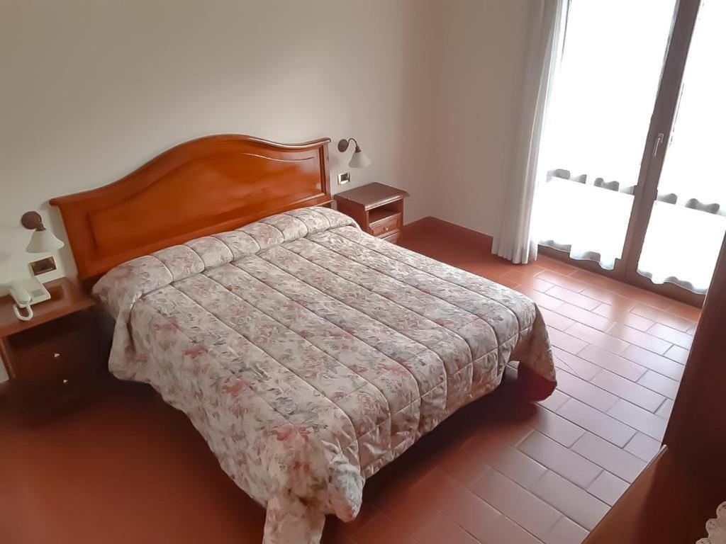 Postel nebo postele na pokoji v ubytování Hotel Panoramique