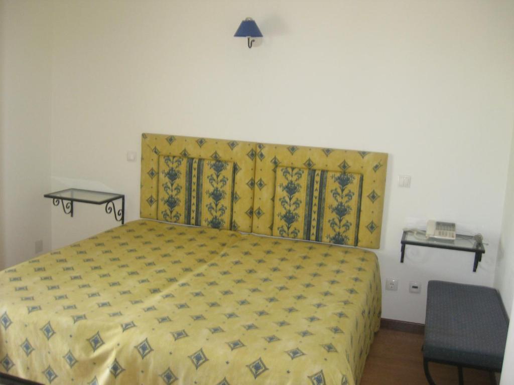 Postel nebo postele na pokoji v ubytování Hotel Minho Belo