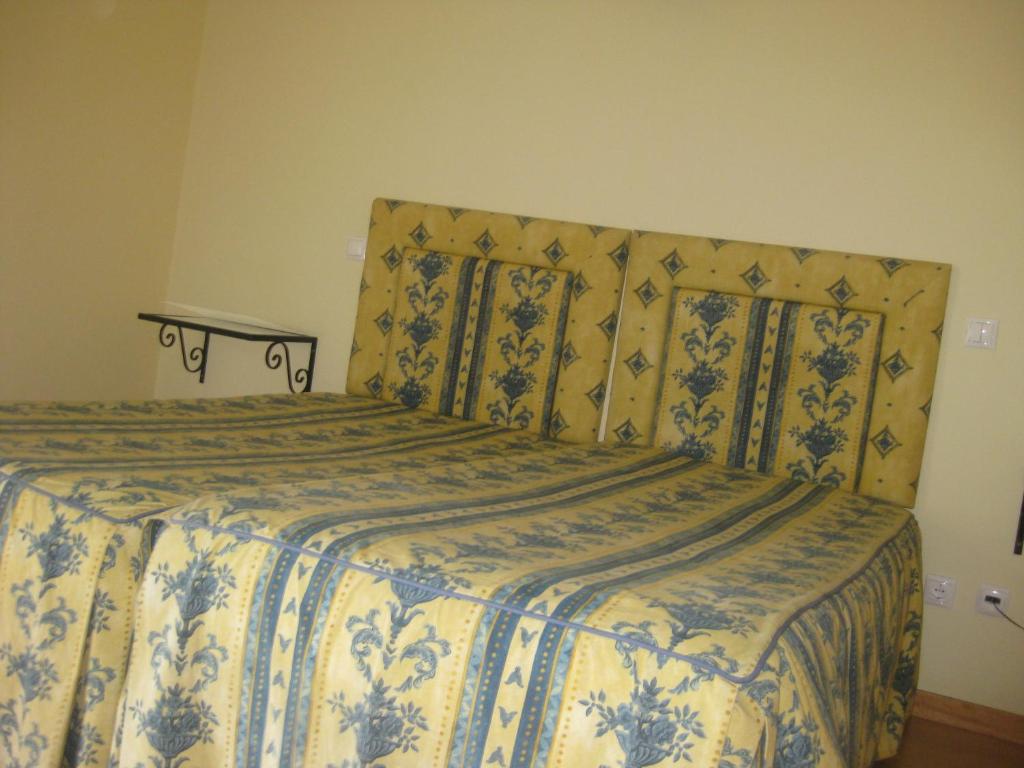 Postel nebo postele na pokoji v ubytování Hotel Minho Belo