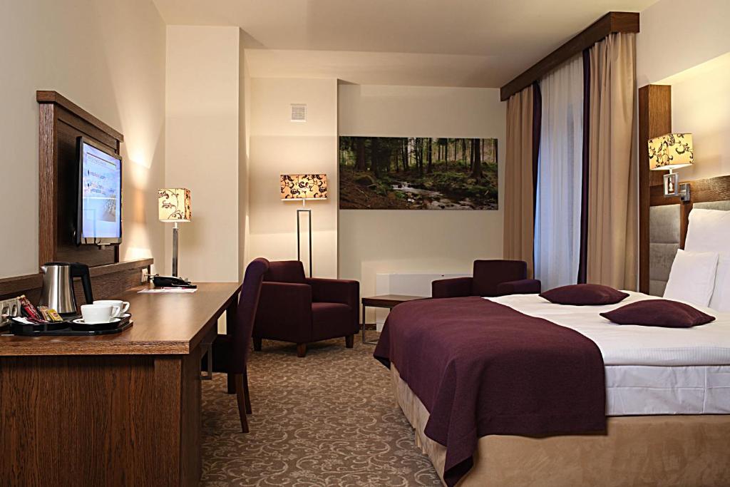 Posteľ alebo postele v izbe v ubytovaní Hotel Mercure Krynica Zdrój Resort&Spa