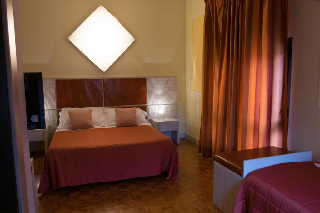 Postel nebo postele na pokoji v ubytování La Vecchia Cartiera