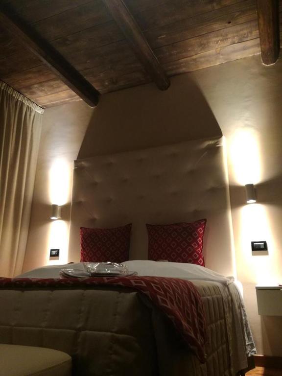 Łóżko lub łóżka w pokoju w obiekcie Hotel Arimannia