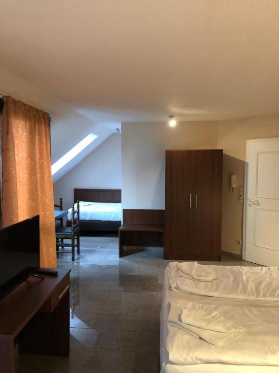Postel nebo postele na pokoji v ubytování Hotel Poseidon