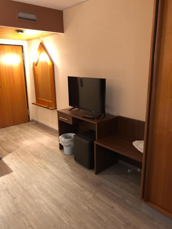 TV a/nebo společenská místnost v ubytování Hotel Poseidon