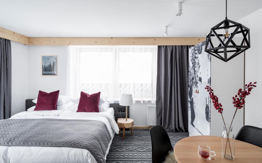 Postel nebo postele na pokoji v ubytování Villa Górska Ski & Bike