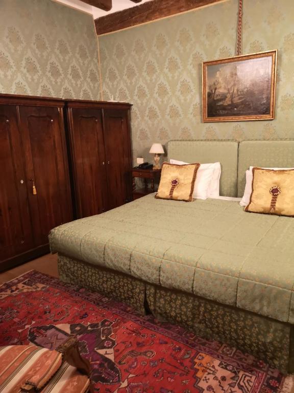 Postel nebo postele na pokoji v ubytování Relais Alberti