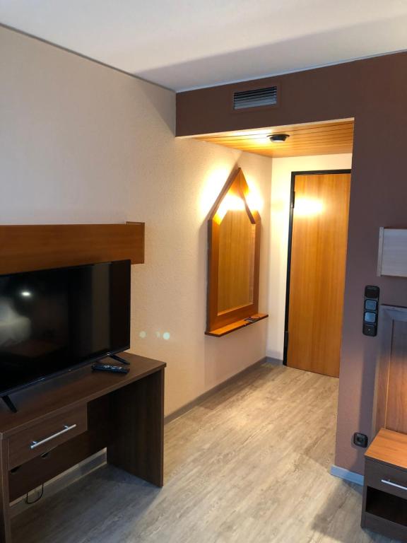TV a/nebo společenská místnost v ubytování Hotel Poseidon