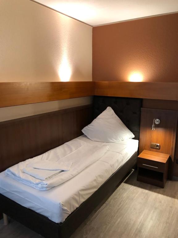 Postel nebo postele na pokoji v ubytování Hotel Poseidon