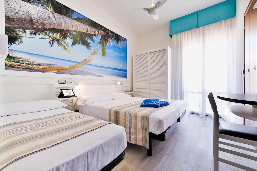 Postel nebo postele na pokoji v ubytování Hotel Fabrizio