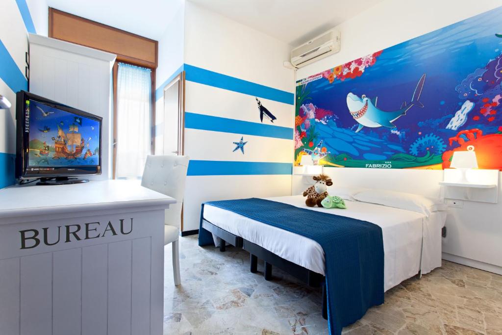 Postel nebo postele na pokoji v ubytování Hotel Fabrizio