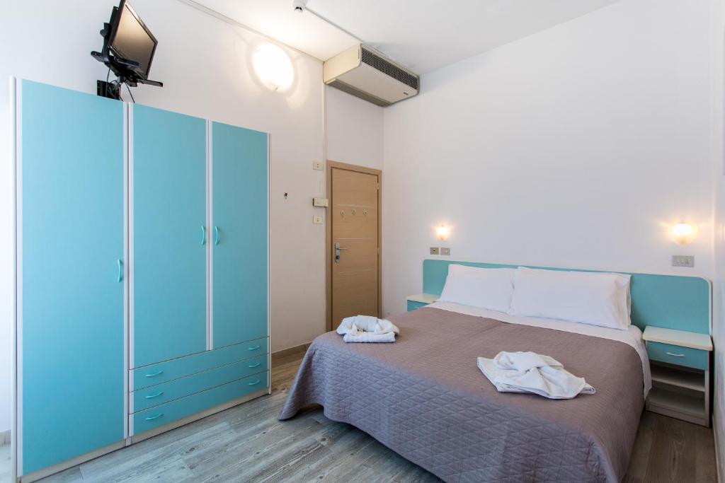 Postel nebo postele na pokoji v ubytování Hotel Savana