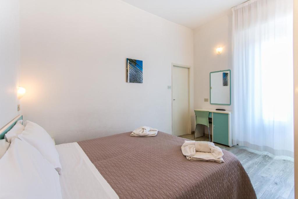 Postel nebo postele na pokoji v ubytování Hotel Savana