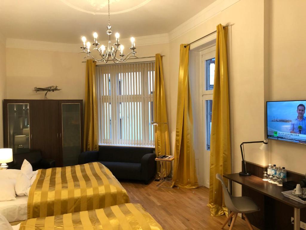 TV a/nebo společenská místnost v ubytování Hotel Wagner im Dammtorpalais