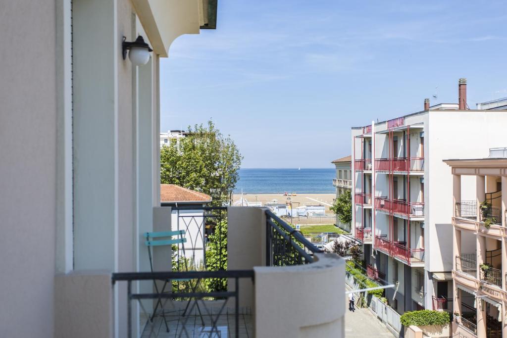 a balcony with a view of the ocean at Hotel Savana in Rimini