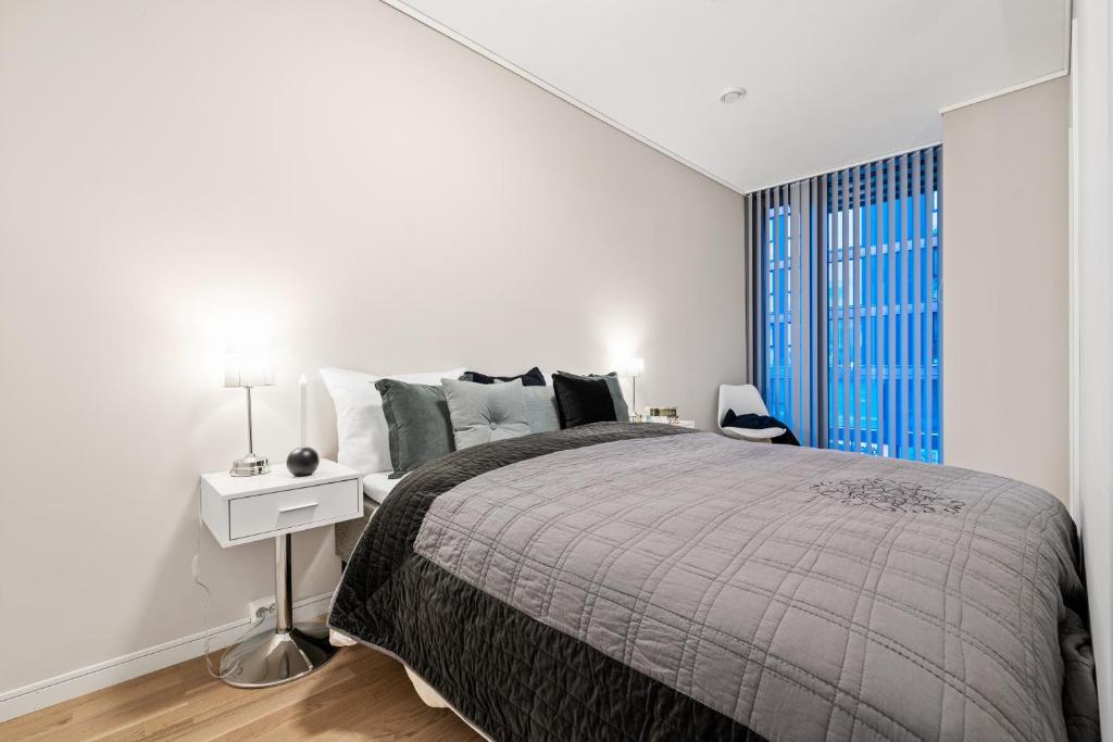 En eller flere senge i et værelse på BJØRVIKA APARTMENTS, Solsiden Area, Trondheim city center