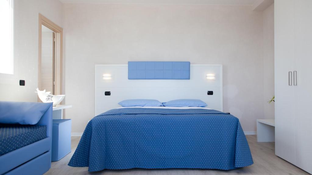 Postel nebo postele na pokoji v ubytování Hotel Rio Bellaria