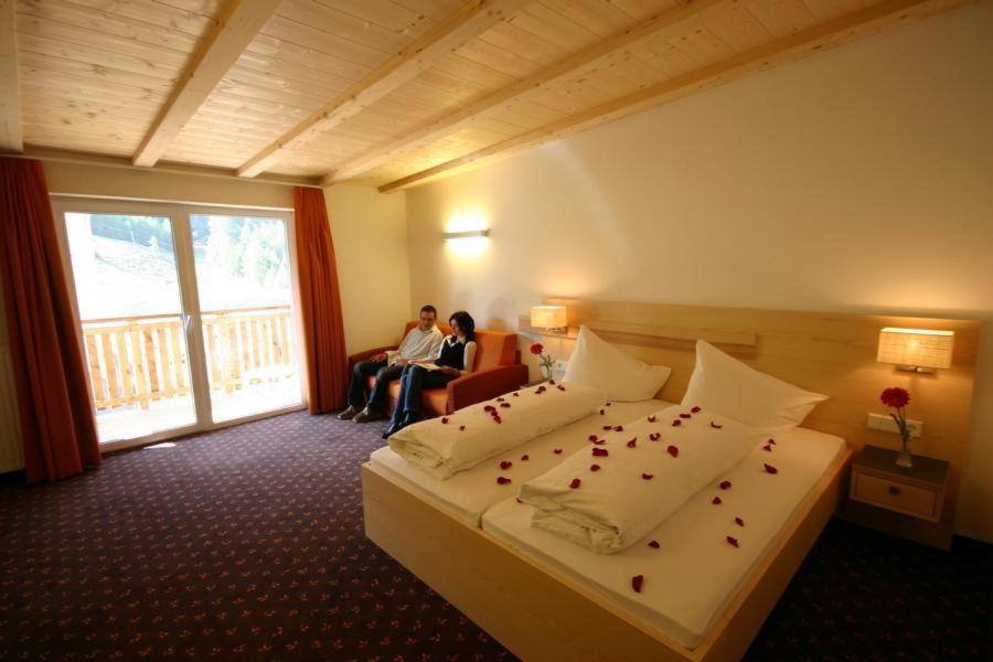 Postel nebo postele na pokoji v ubytování Hotel Mall