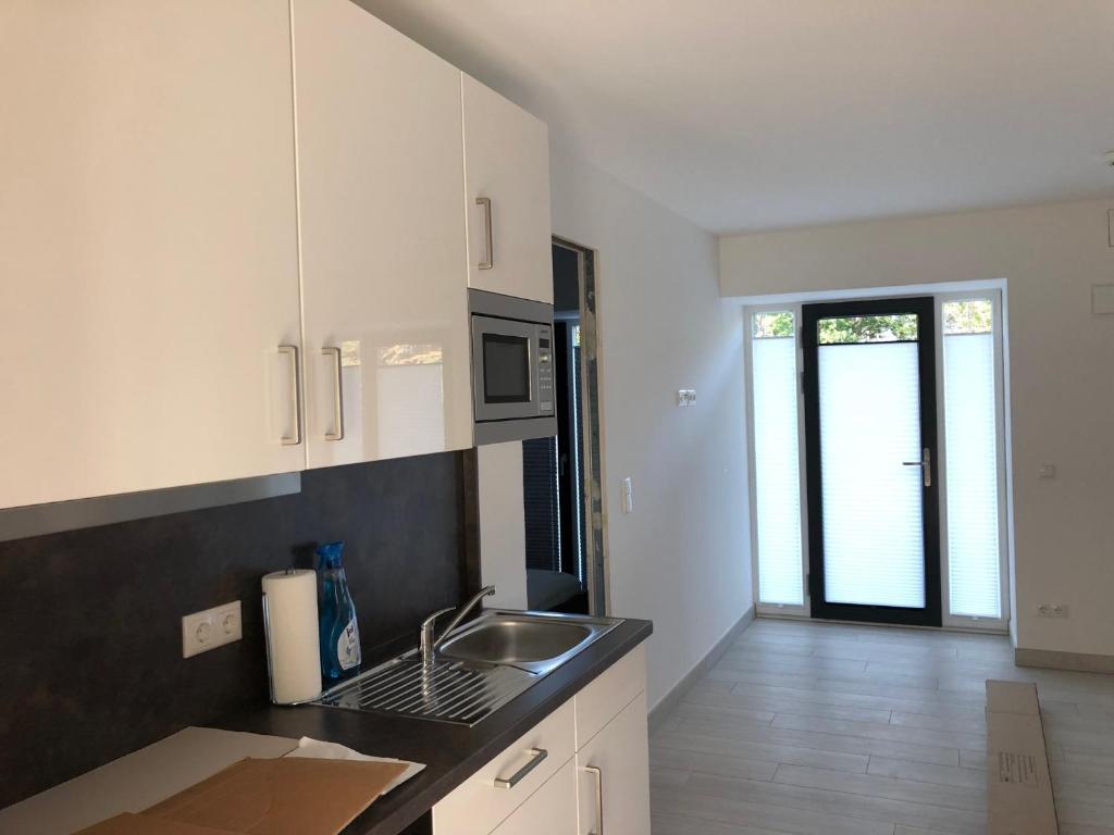 Kuchyň nebo kuchyňský kout v ubytování Strandapartment Meeresrauschen Prora Binz EG