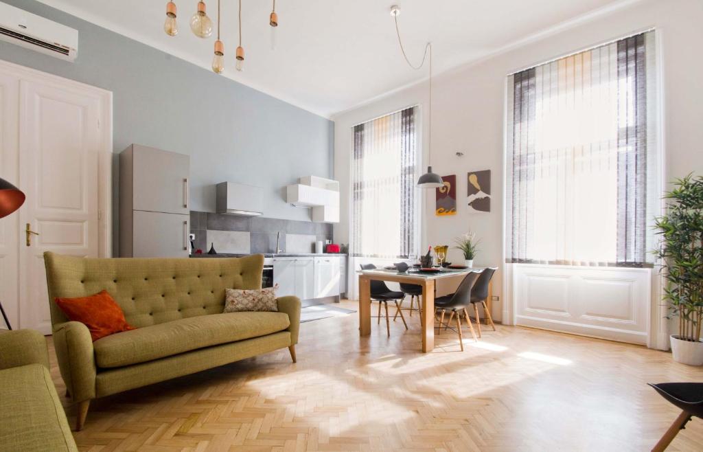 a living room with a couch and a table at Andrassy Boulevard in Budapest