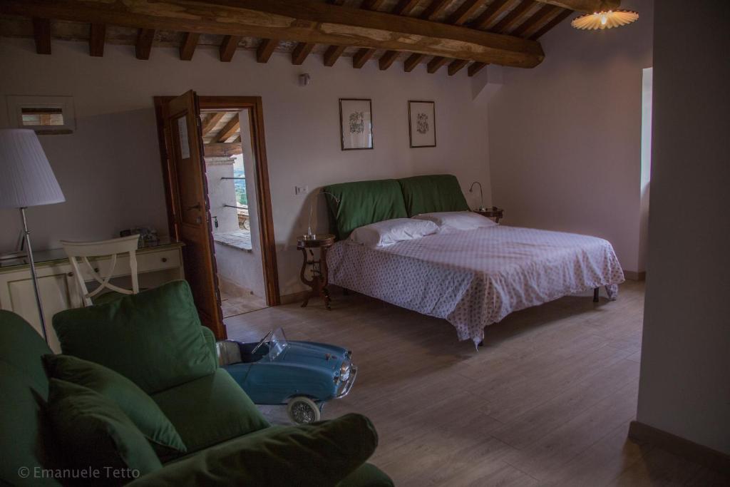 Postel nebo postele na pokoji v ubytování La Collina Degli Ulivi