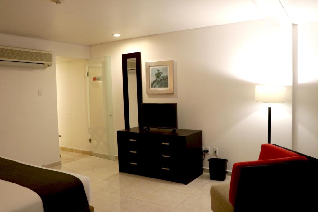 Un lugar para sentarse en Hotel & Suites PF