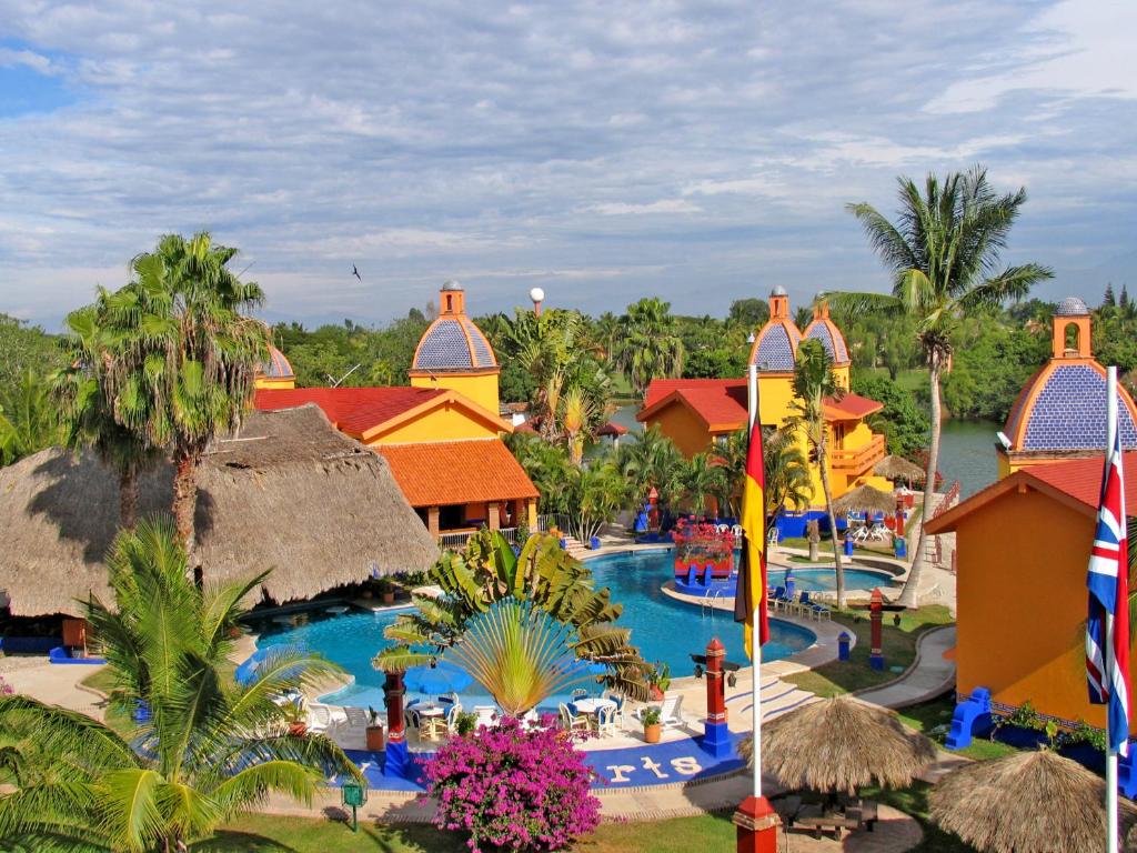 an aerial view of the pool at the disney resort at Canadian Resort Vallarta in Bucerías