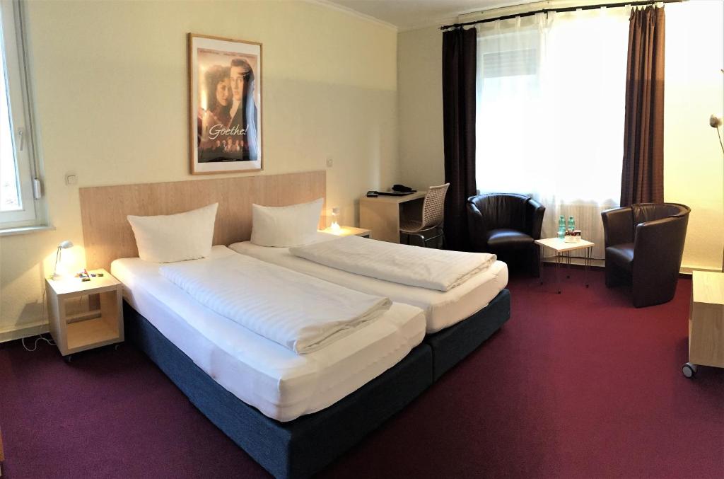 Postel nebo postele na pokoji v ubytování Hotel Weidenhof