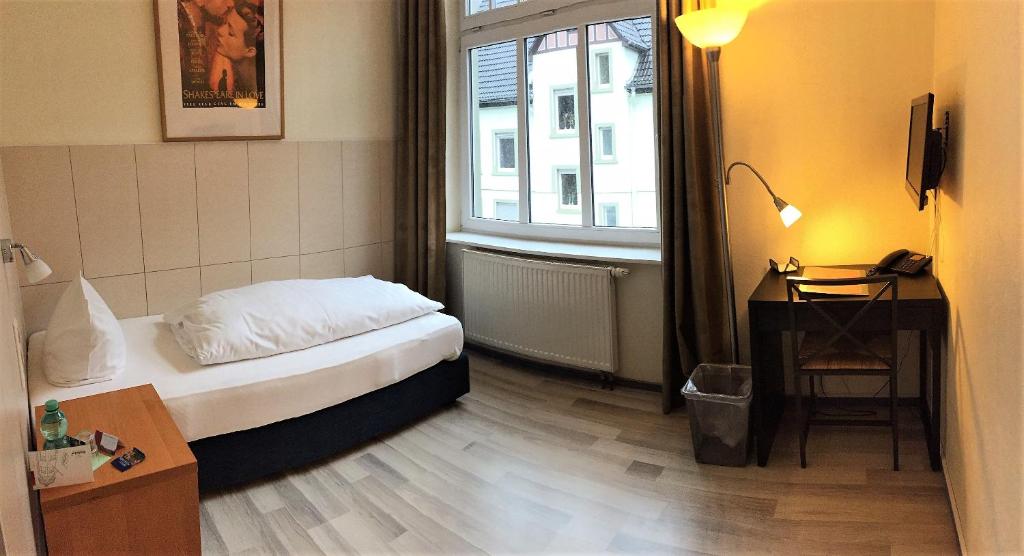 Postel nebo postele na pokoji v ubytování Hotel Weidenhof