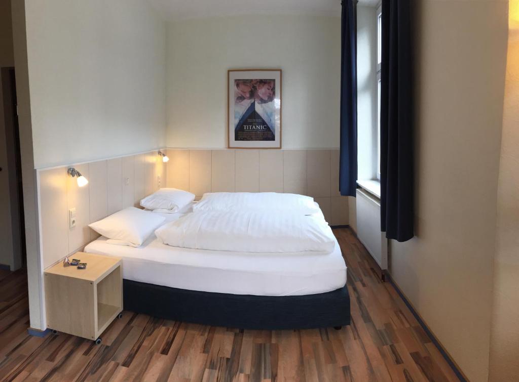 Postel nebo postele na pokoji v ubytování Hotel Weidenhof
